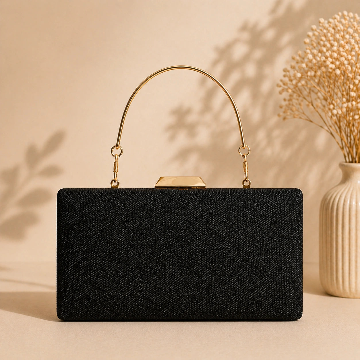 Luxury handcrafted black evening clutch with metal handle