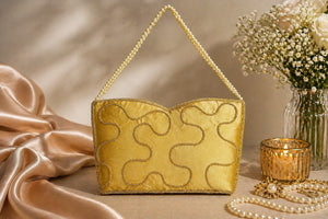 Elegant gold ethnic clutch bag for party wear